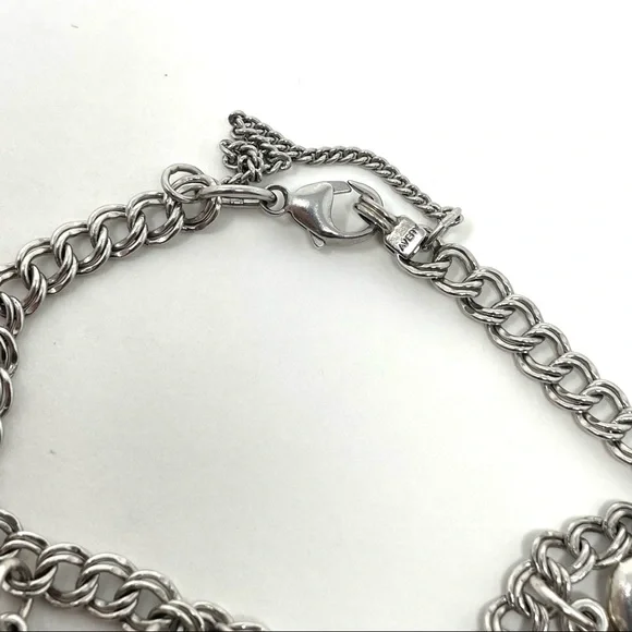 JAMES AVERY sterling silver charm bracelet, 8 charms Bracelets